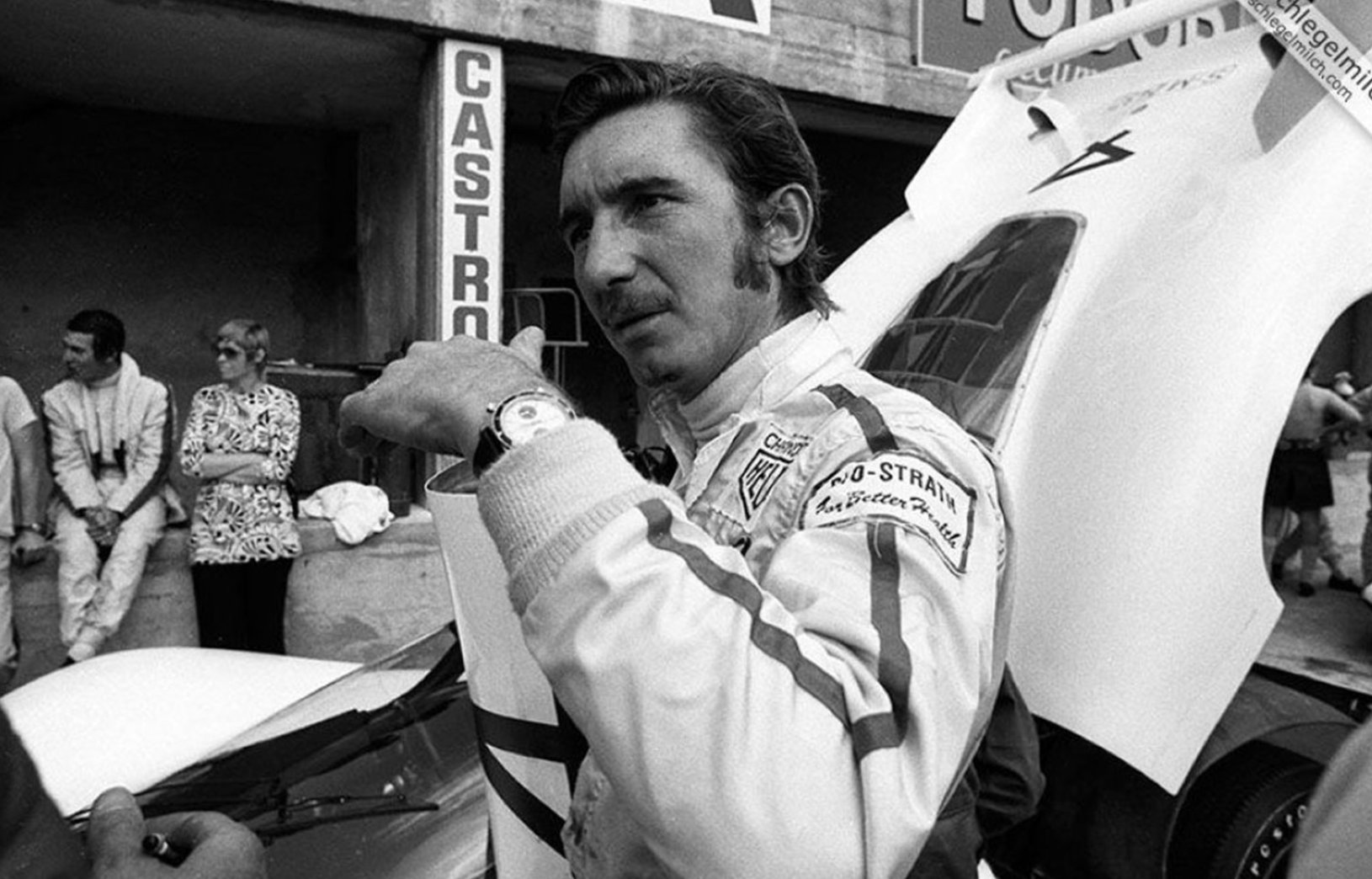 Jo Siffert in racing suit, displaying Heuer Autavia on wrist